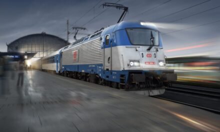 How do railway systems contribute to the automotive industry in terms of logistics and supply chains?