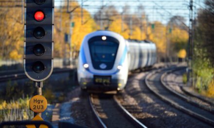 How do international standards and regulations govern the design and operation of railway vehicles?